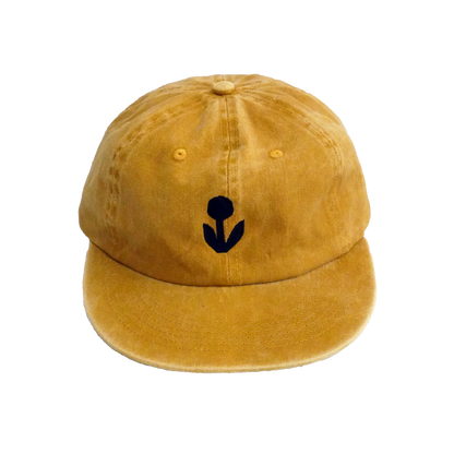 Groundwork unstructured 6-panel cotton hat in marigold with embroidered flower logo on front.